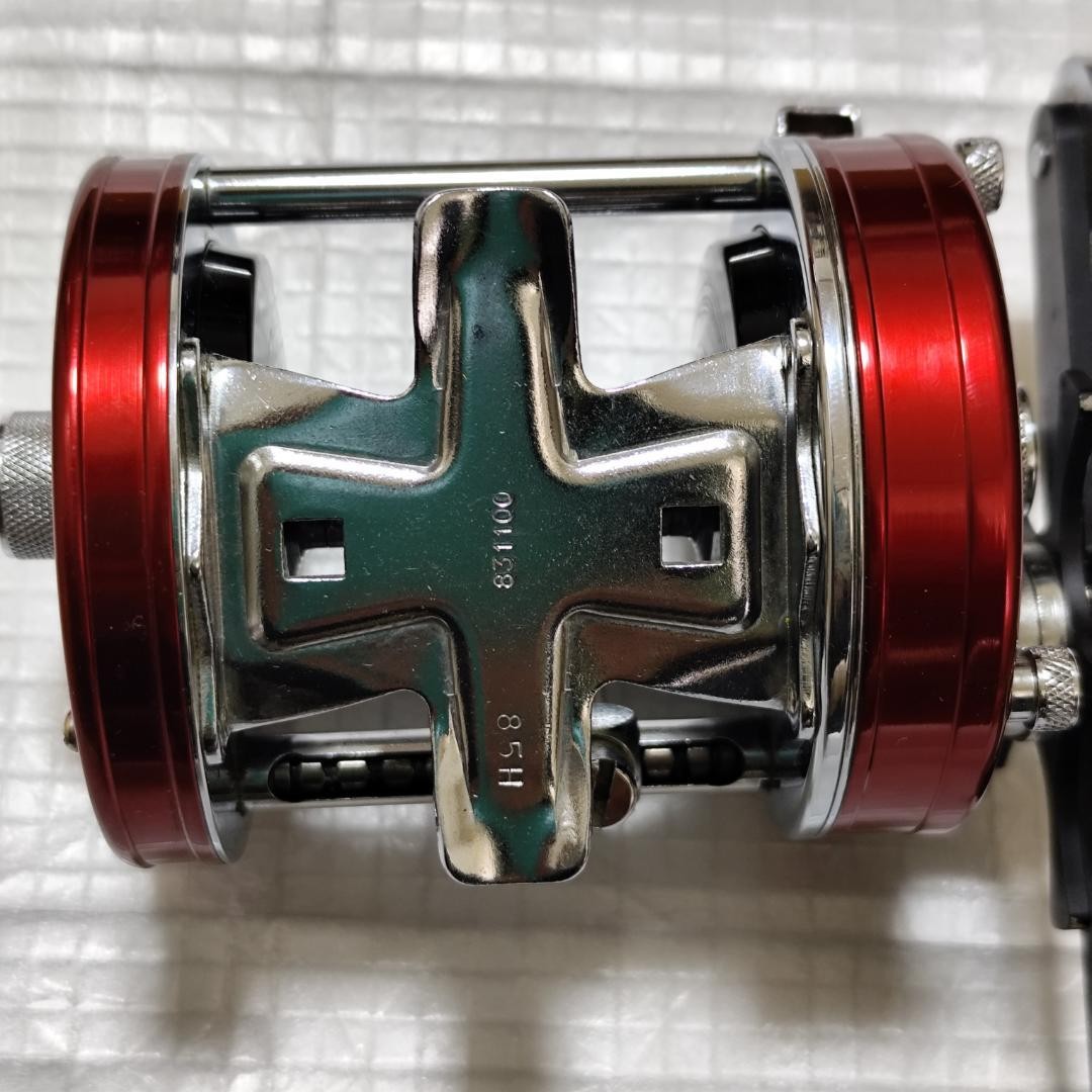 Abu Garcia ABU Ambassador 7000 Red with box, instruction manual, and user’s