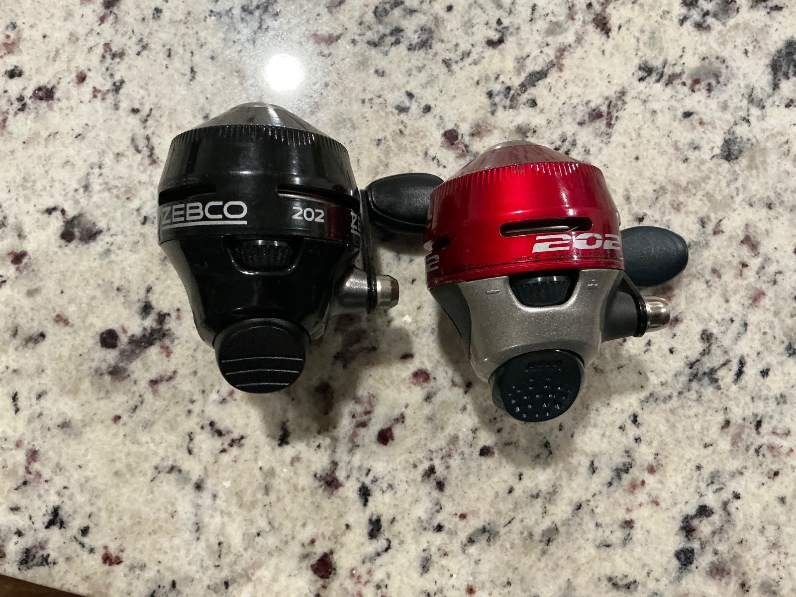 lot of 2 Zebco 202 spincast reels red and black A+