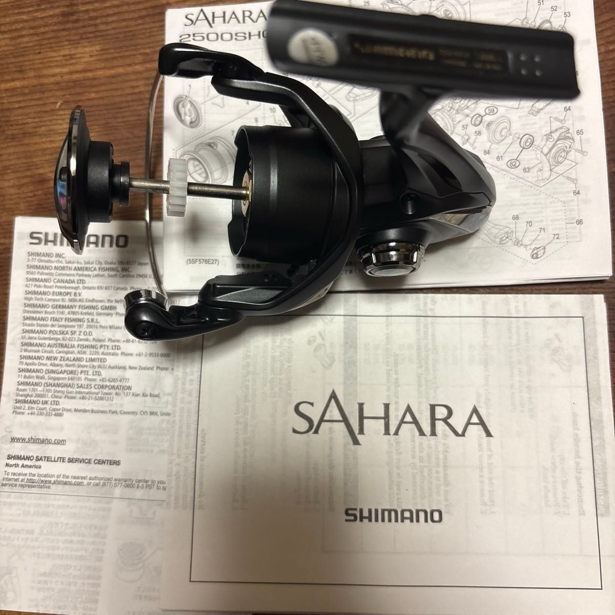 Unused SHIMANO 22SAHARA C3000 spinning reel with drag knob.