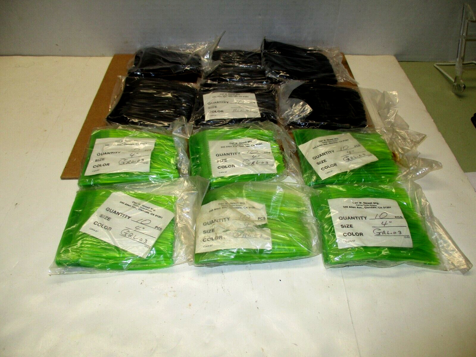 NEWELL REELS ** NEWELL SKIRTS * NOS ** 4 INCH **12 PACKS ** 6- GREEN & 6-BLACK**