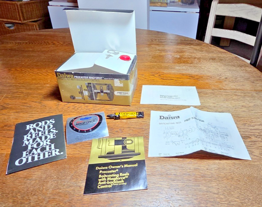 Daiwa PMF55HBaitcasting Fishing Reel Box, Owners Manual, Oil, Papers