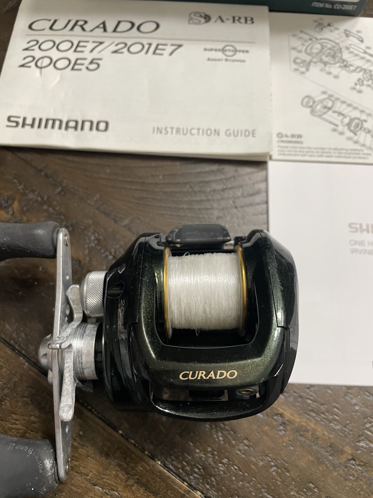 Shimano Curado 200E7 Right Handed Conventional Fishing Box Papers Oil Used Cond
