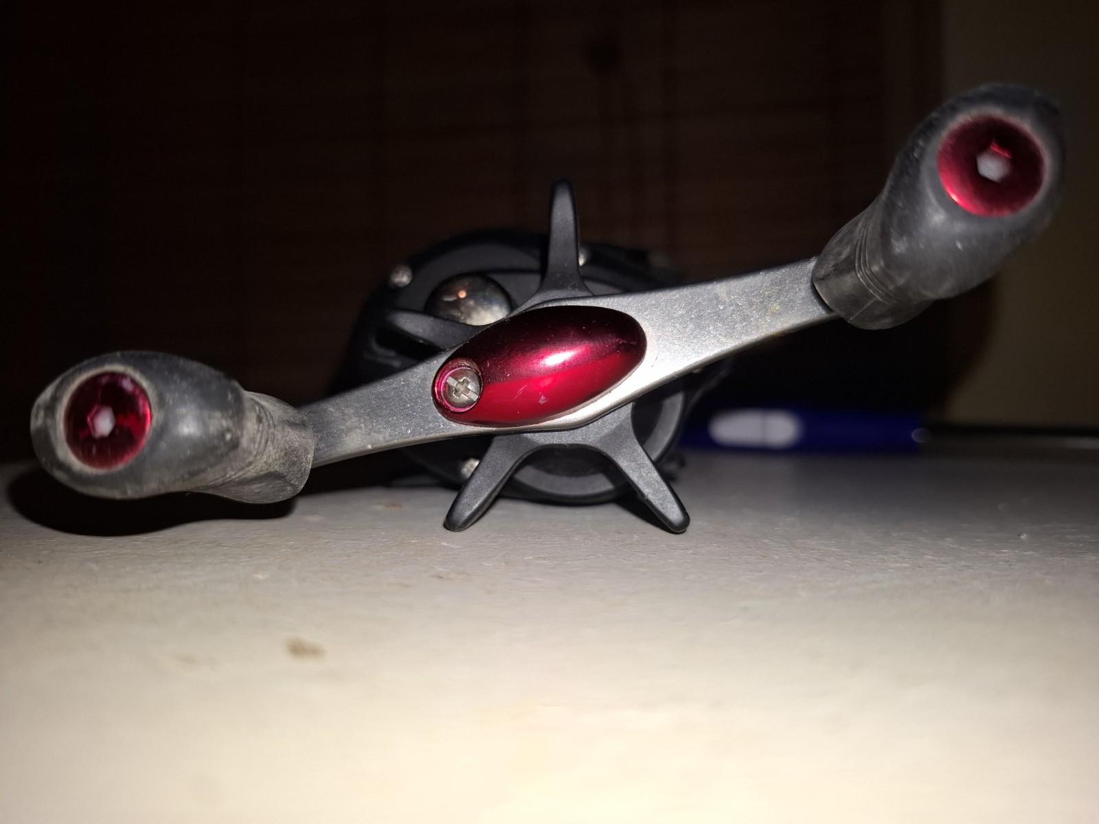 Shakespeare Baitcast Reel Star Drag Dual Paddle Handle Black Red Silver