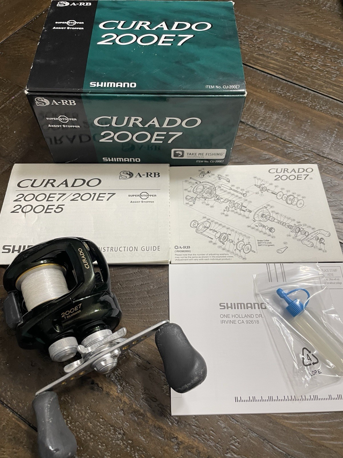 Shimano Curado 200E7 Right Handed Conventional Fishing Box Papers Oil Used Cond
