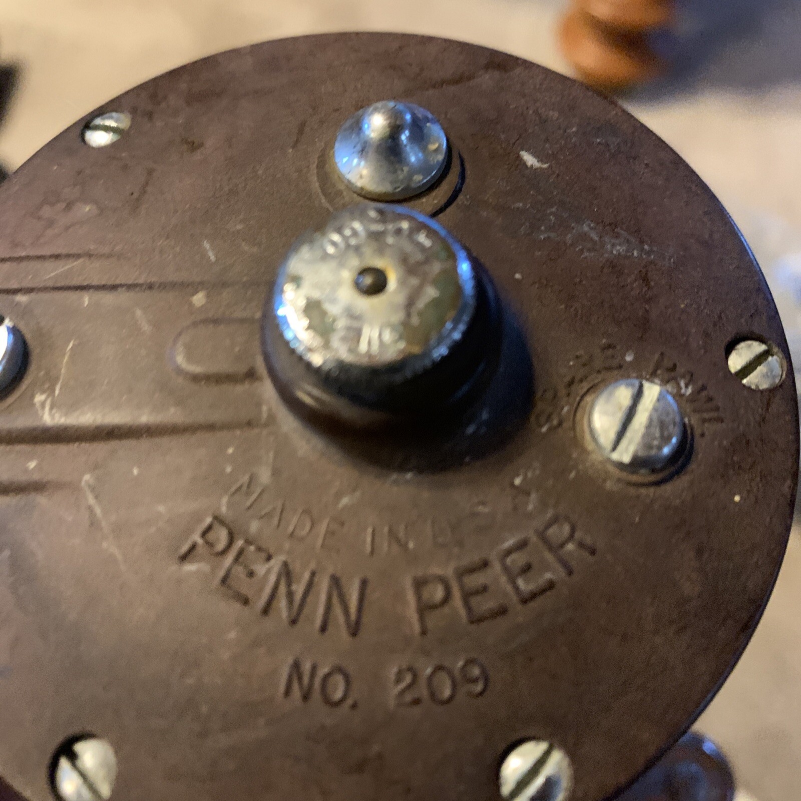 Penn Maroon Peer # 209 with a Metal Spool & a Beige Knob.