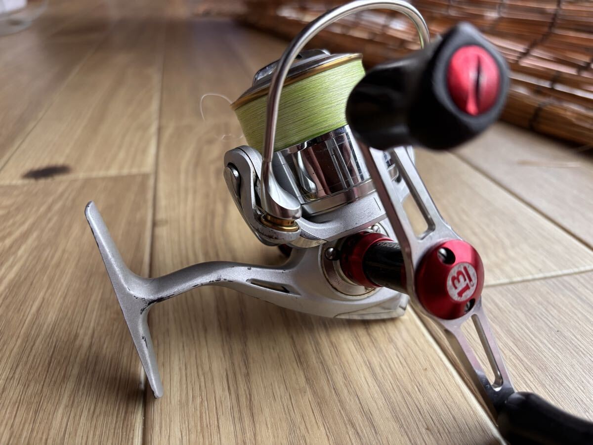 Daiwa LUVIAS 2506 Spinning Reel with Premium Omamori-kun, Breaden W Handle, and