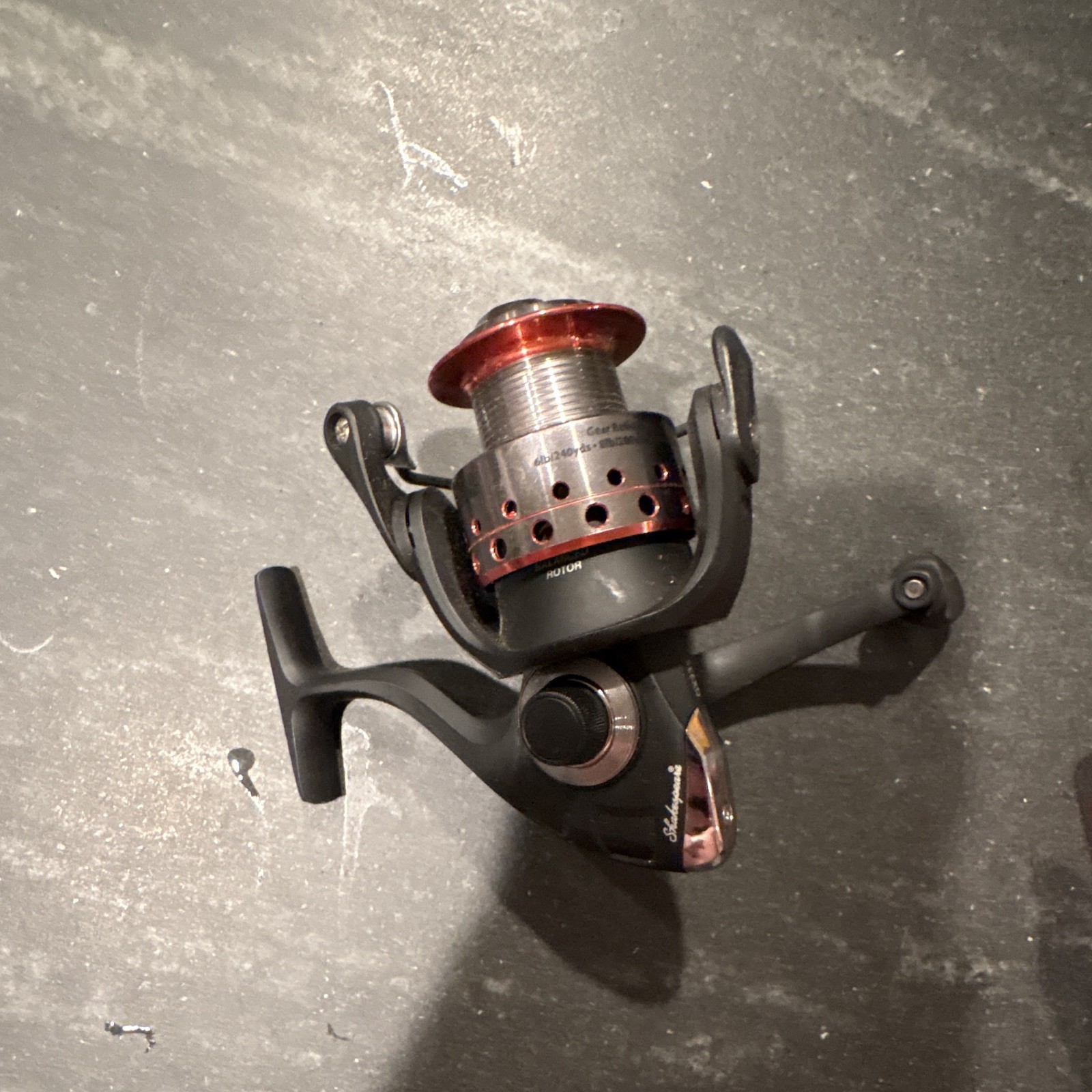 Shakespeare Spinning Reel Right-Hand Retrieve Front Drag Black/Red