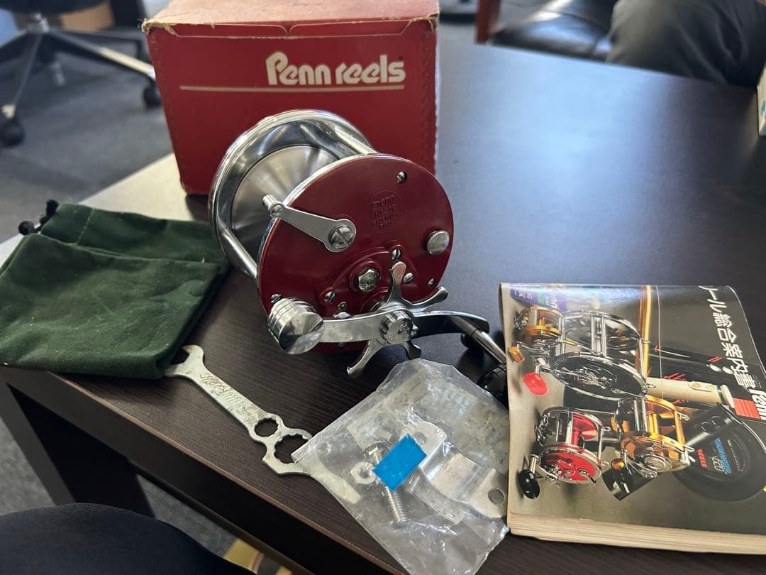 Penn reel with instructions, spare parts, storage bag unused