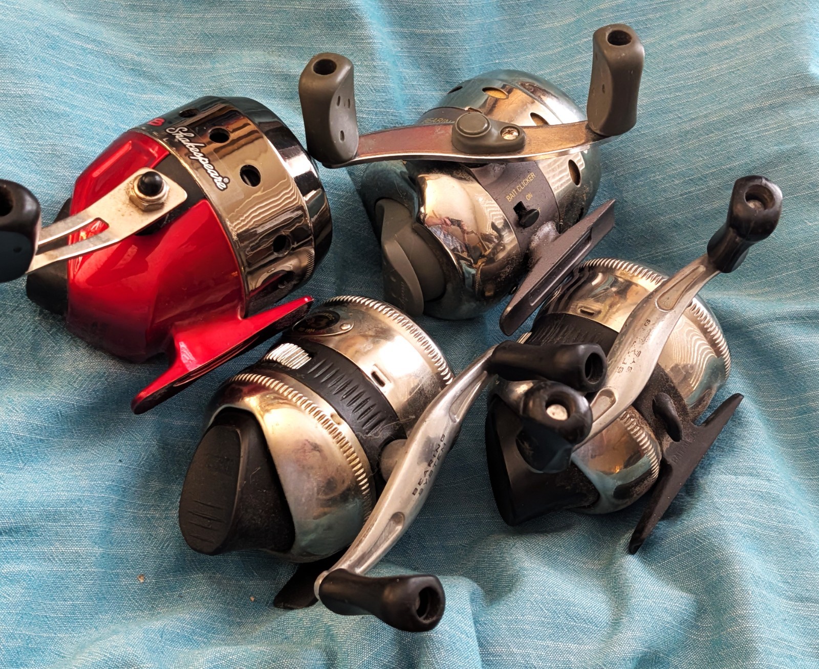 4 Spincast Reel lot: 2 Zebco 33’s, 1 Photon, and 1 Shakespeare Reverb