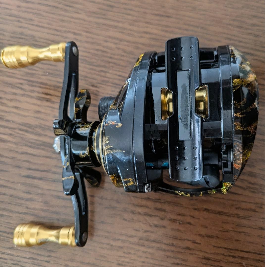 PROBEROS Japanese pattern double-shaft reel black & gold unused left-hand