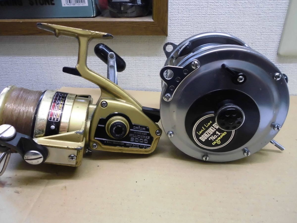 Two extra-large reels. Olympic DOHZUKI-DX-N01, Daiwa Million Max MILLIOAX9000 –