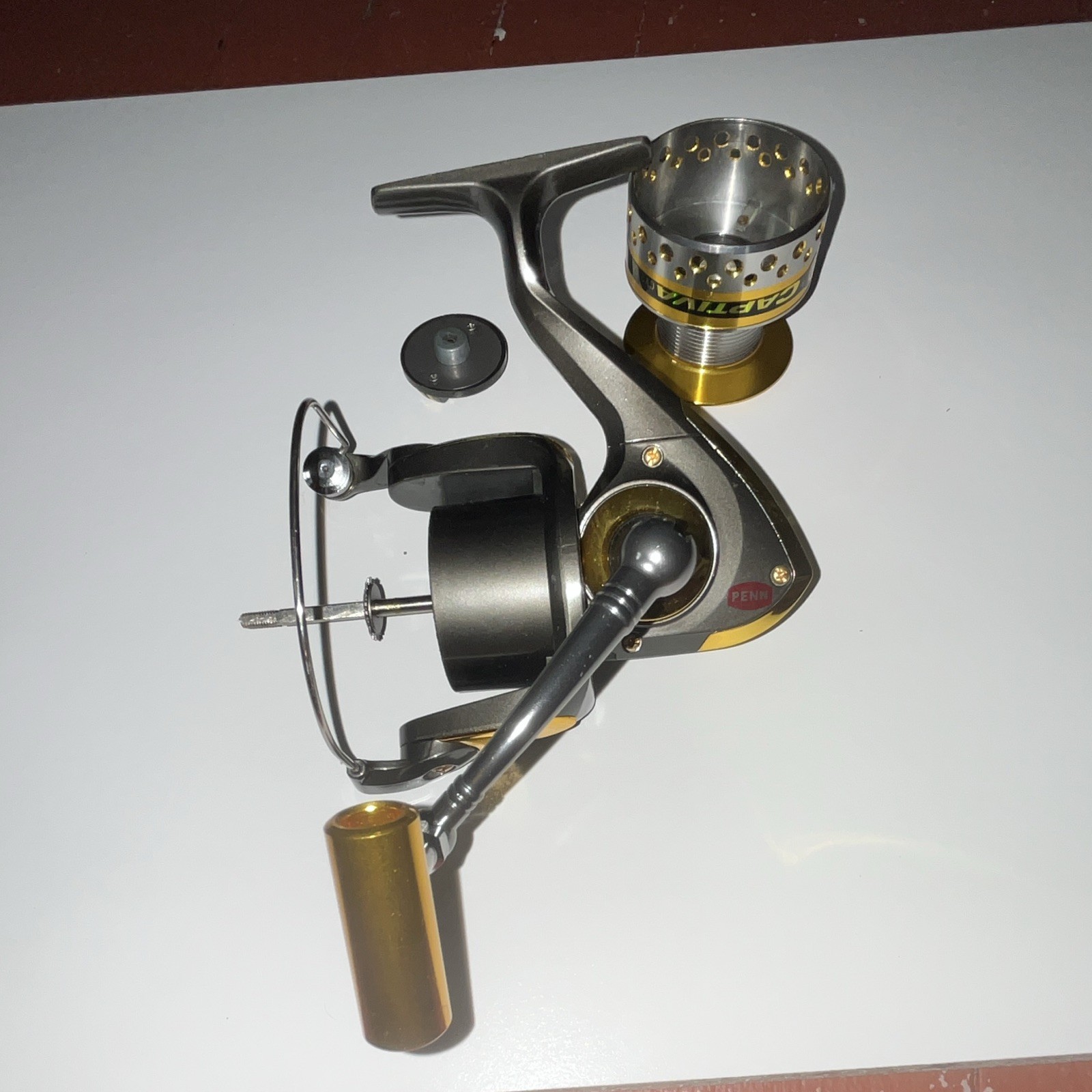 PENN Captiva 6000 Spinning Reel 6.2:1 10BB Front Drag Gray/Gold +Spare