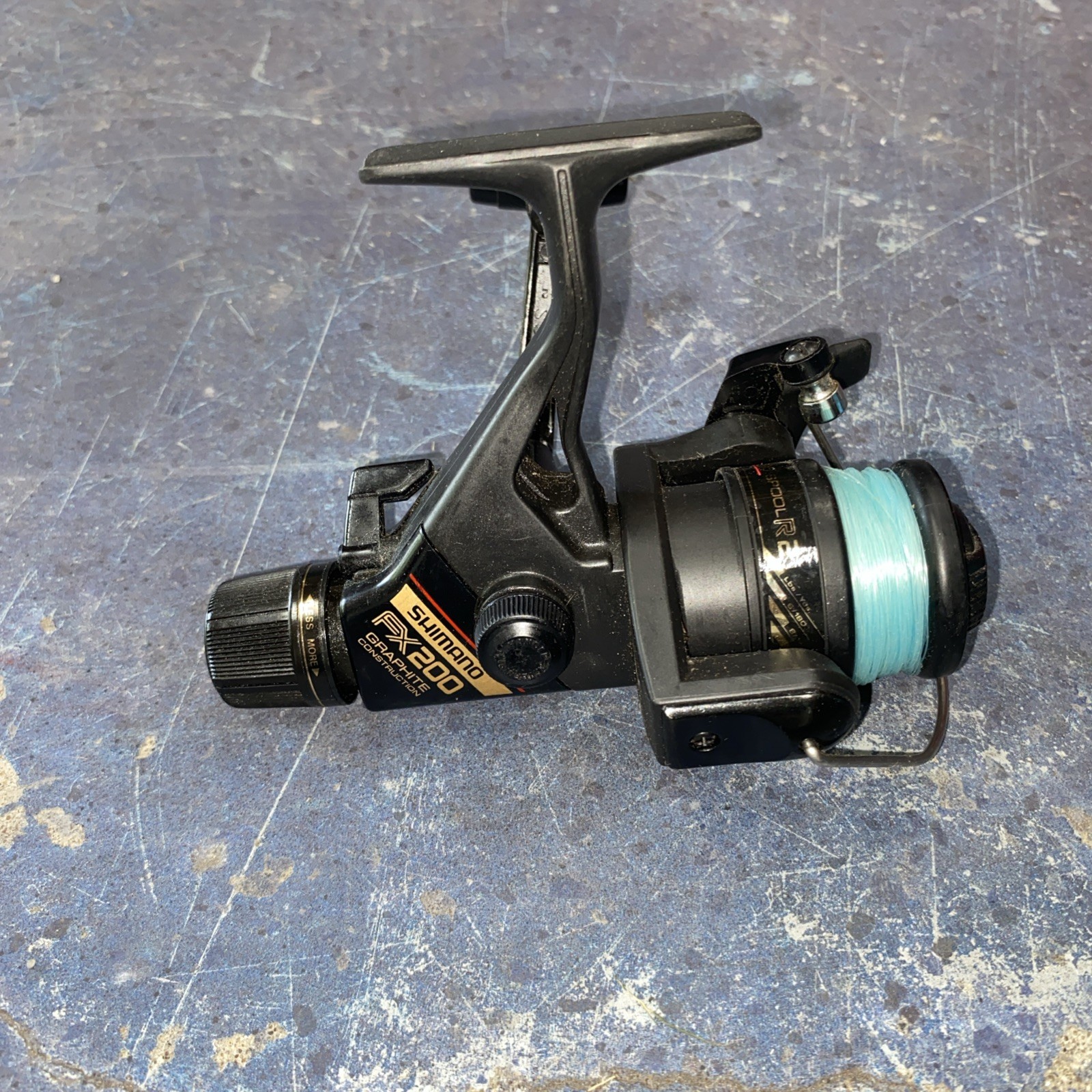 Shimano FX200 Quickfire II Spinning Fishing Reel Graphite, L/R Hand- Excellent