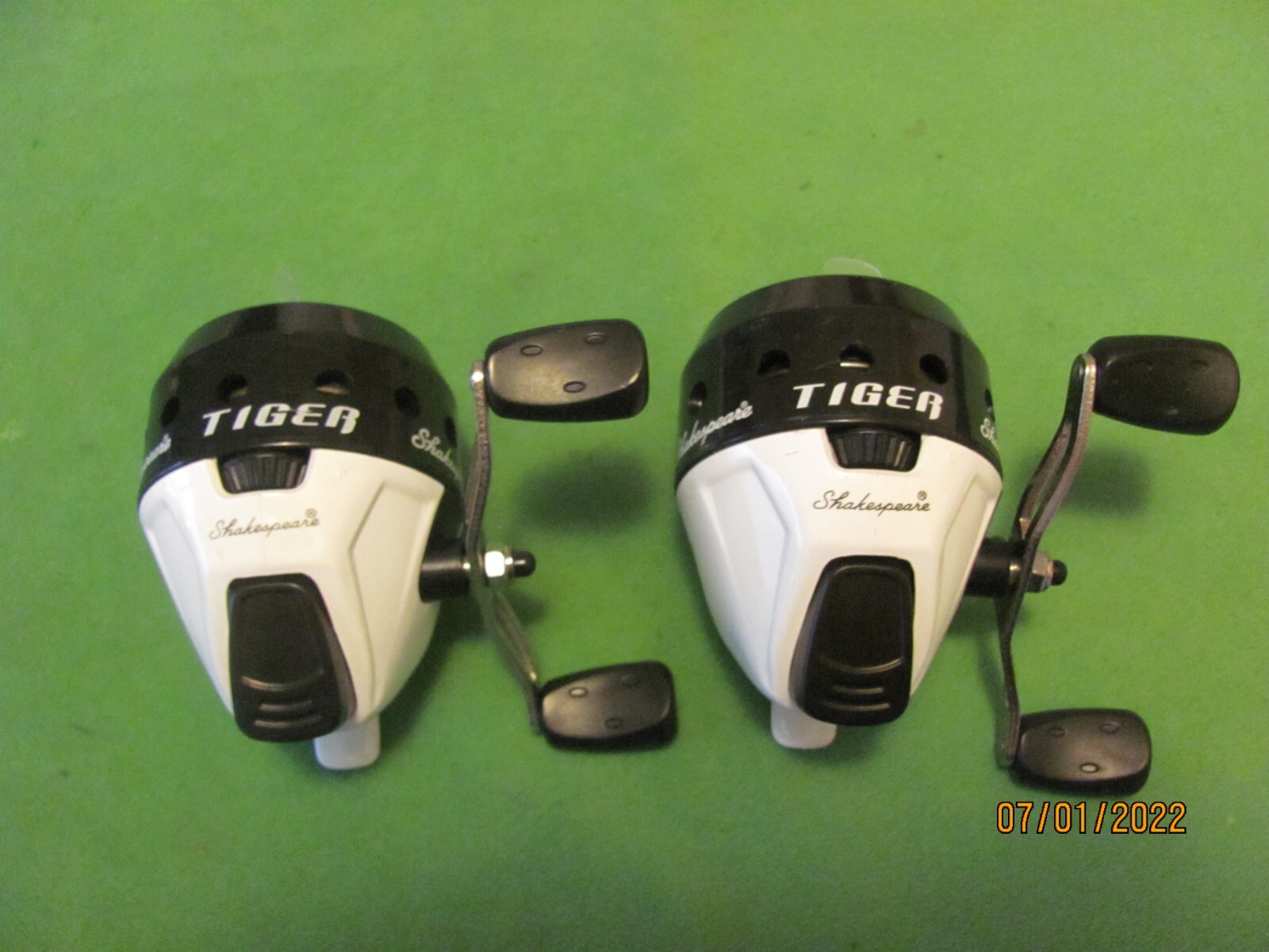 1 Pair of Shakespeare Tiger Spin-casting Reels Spooled with Line. White & Black.
