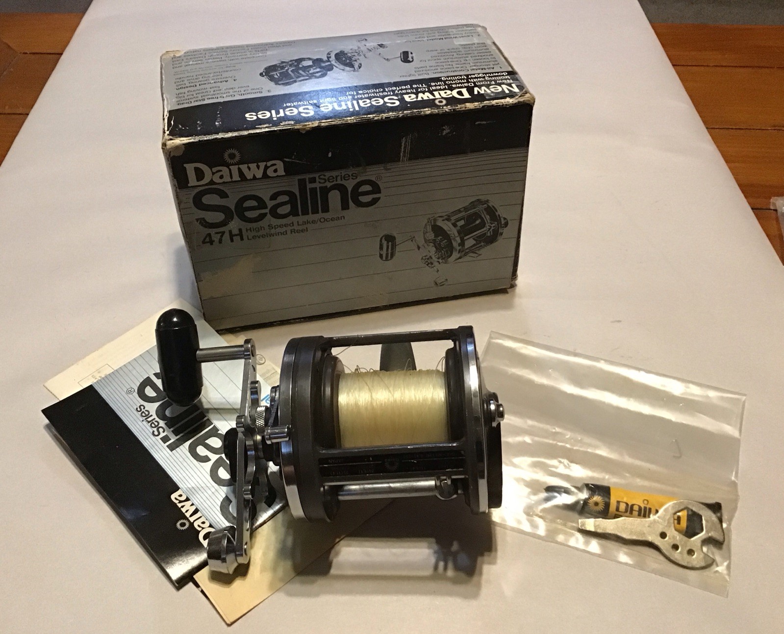 Daiwa Sealine 47H Fishing Reel, rod clamps, tools, Lube,Manual & Original Box