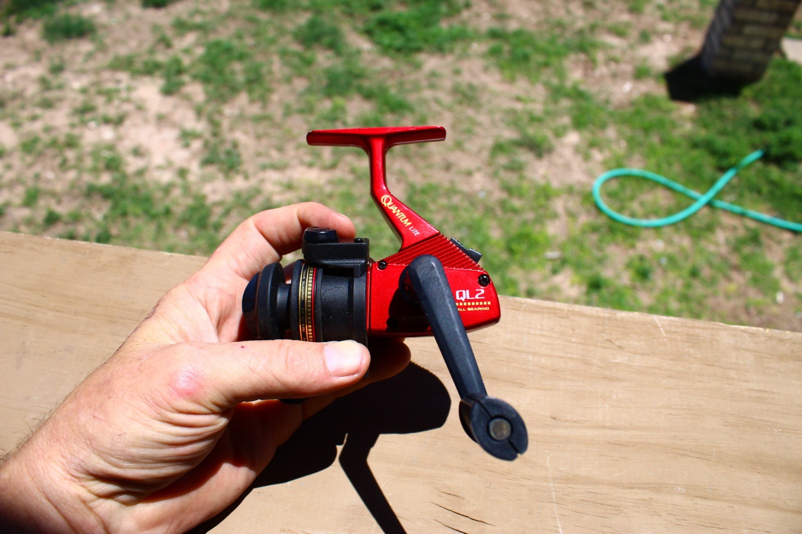 Red Zebco Quantum Lite QL2 spinning fishing reel