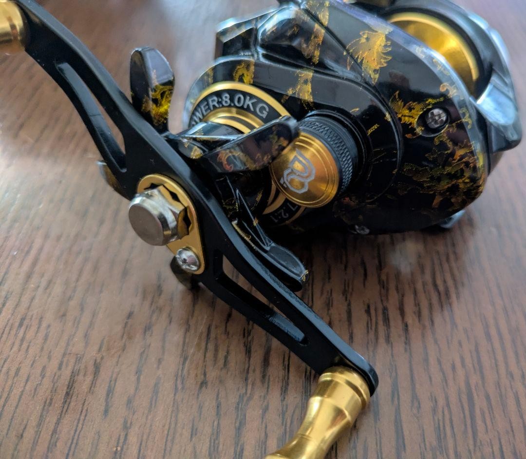PROBEROS Japanese pattern double-shaft reel black & gold unused left-hand