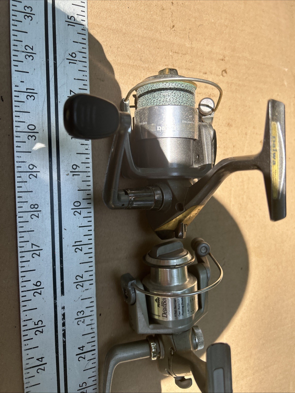 2-spinning Reels One Daiwa And One Pinnacle