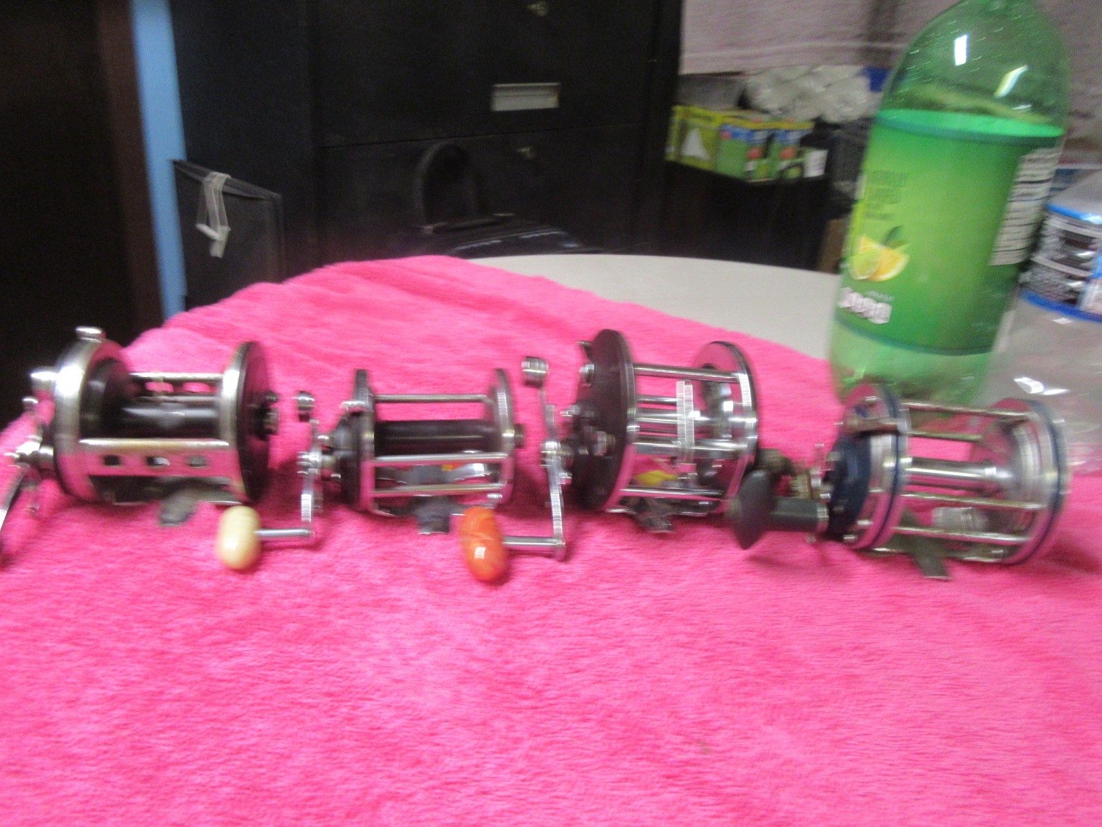 456194-B (4) Pack of Penn 500 Jig, 155, 309 L/W, & Olympic Dolphin 614 Reels