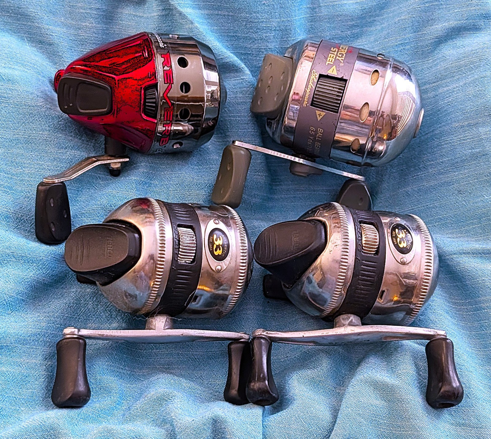 4 Spincast Reel lot: 2 Zebco 33’s, 1 Photon, and 1 Shakespeare Reverb
