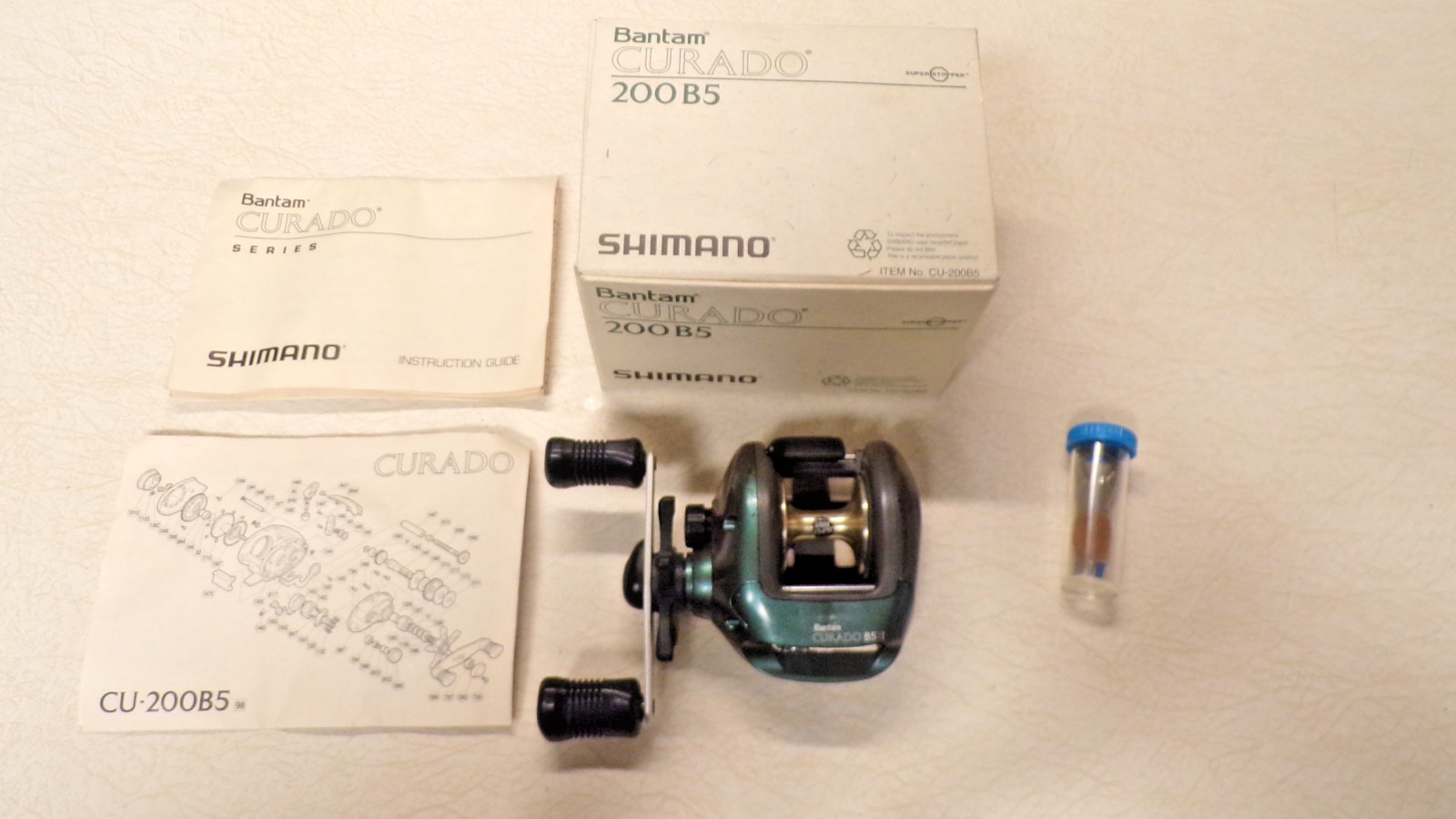 SHIMANO FISHING REEL W/ BOX – BANTAM CURADO 200-B5 – CLEAN & WORKS GREAT