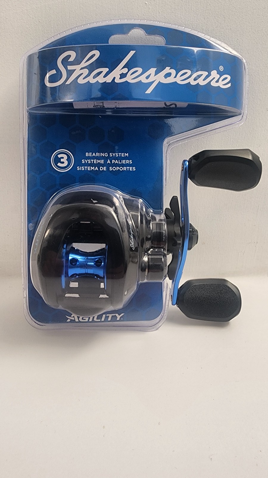 Shakespeare Agility LP baitcasting reel (low-profile, black/blue colorway). 3-be
