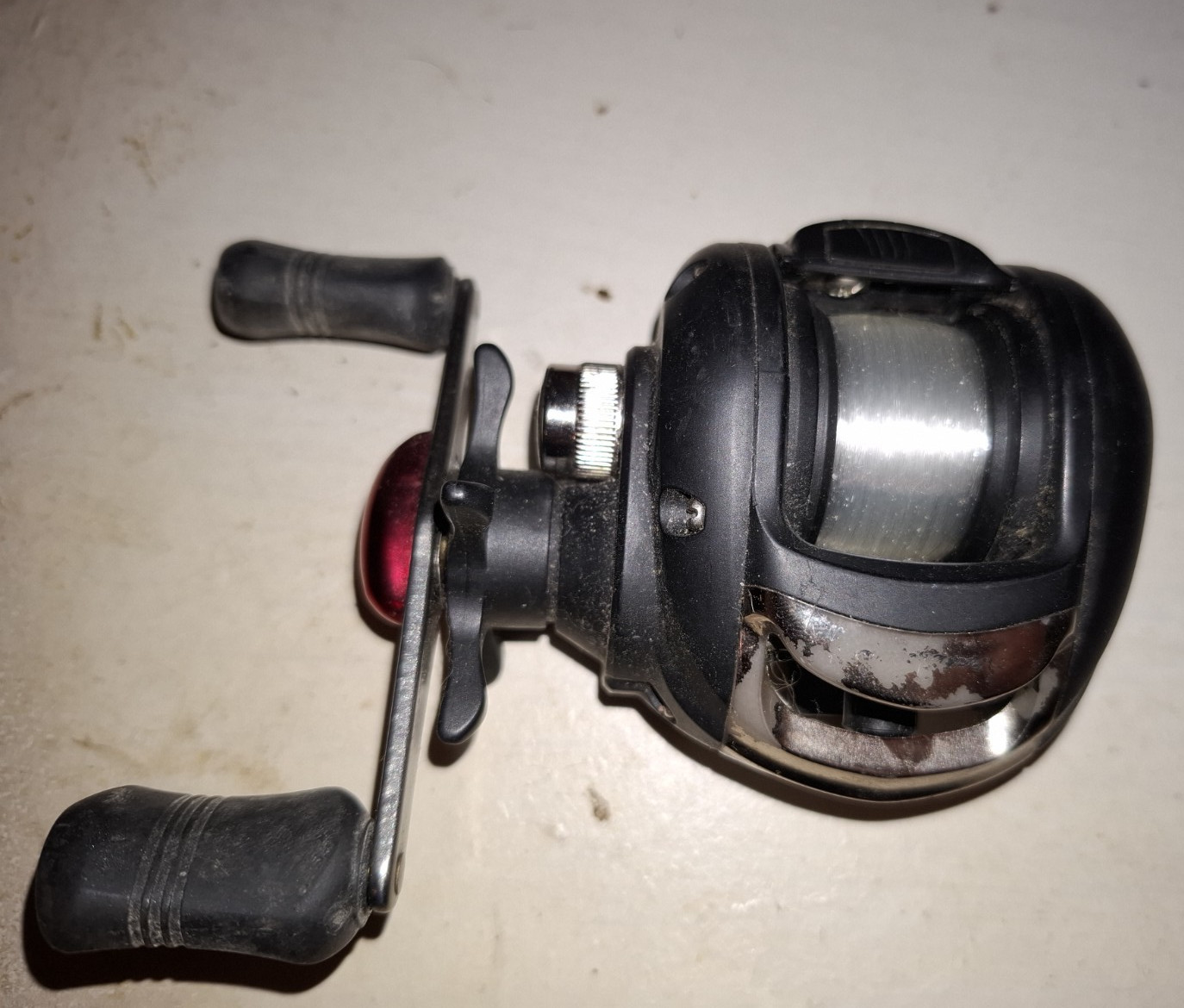 Shakespeare Baitcast Reel Star Drag Dual Paddle Handle Black Red Silver