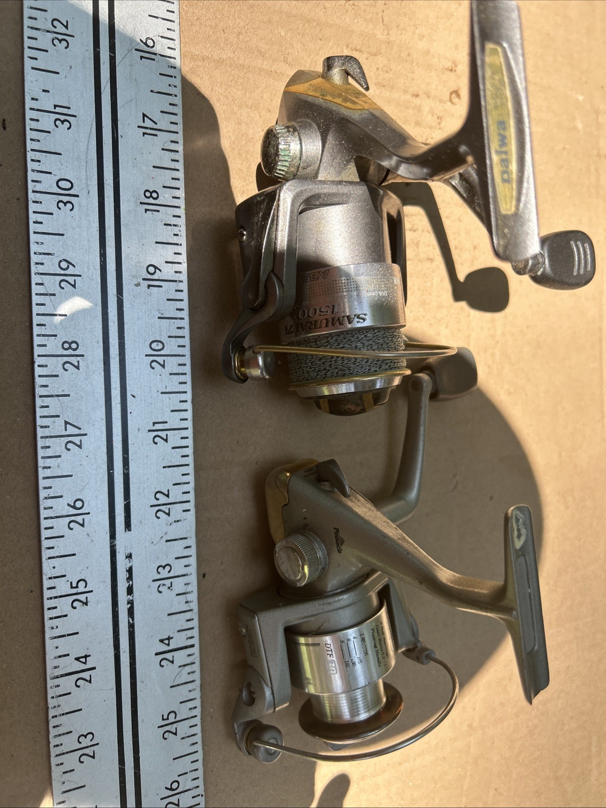 2-spinning Reels One Daiwa And One Pinnacle