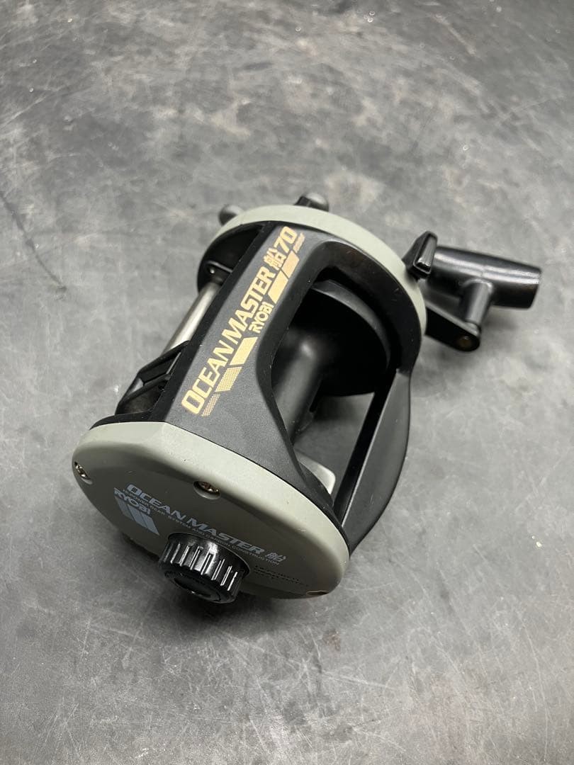 RYOBI Ocean Master 70 Fishing Reel Black/Gray Multi-Color Line Used