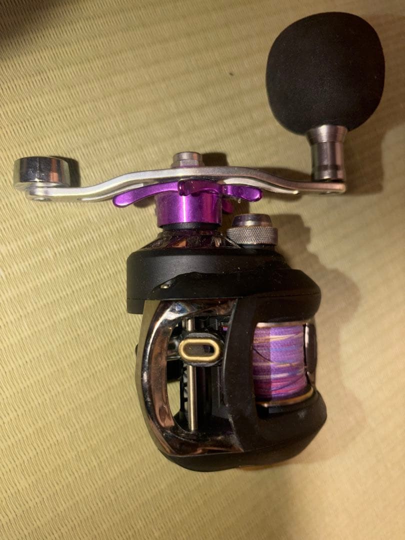 Black and Purple Design Reel with Rubber Grip Used