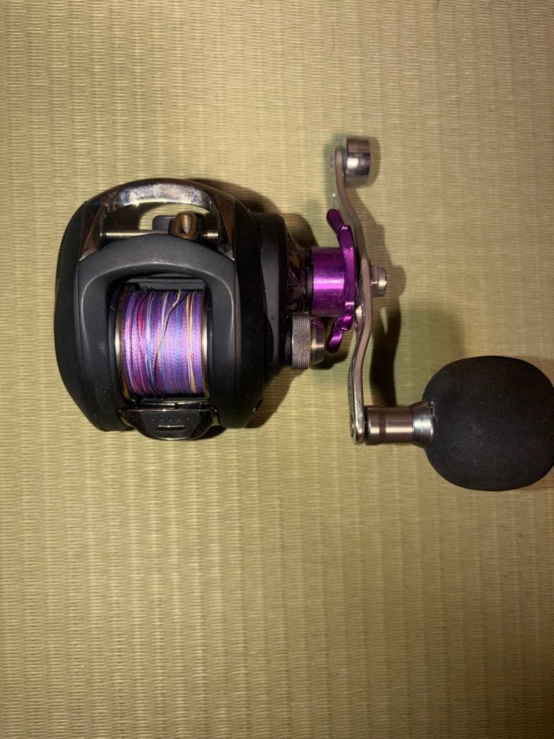 Black and Purple Design Reel with Rubber Grip Used
