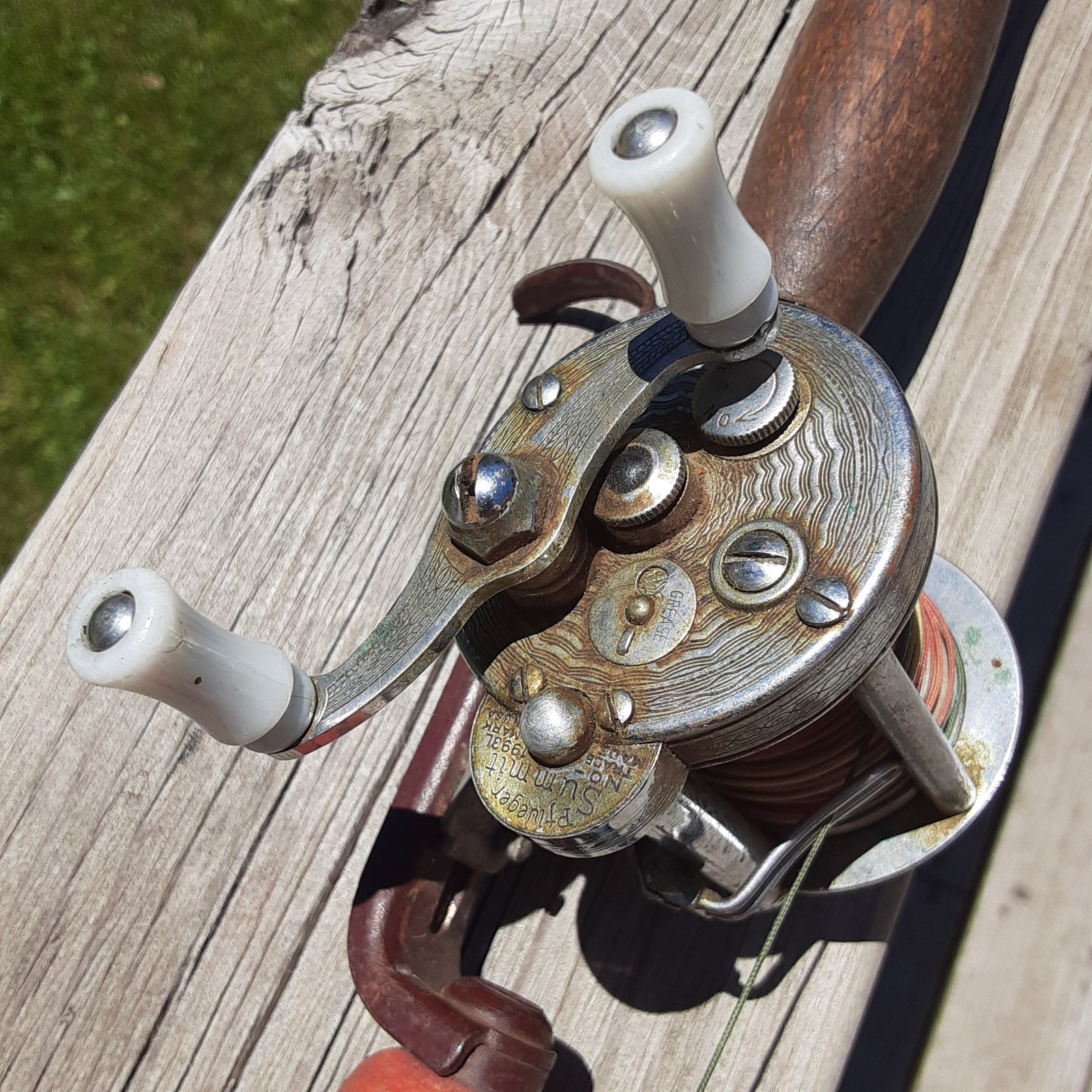 PFLUEGER SUMMIT 1993L direct drive baitcast mounted on 50″ pole only 2 eyelets