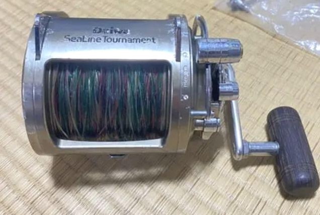 Daiwa Tournament SLT50W / fishing /Reel / scratches and stains /japan
