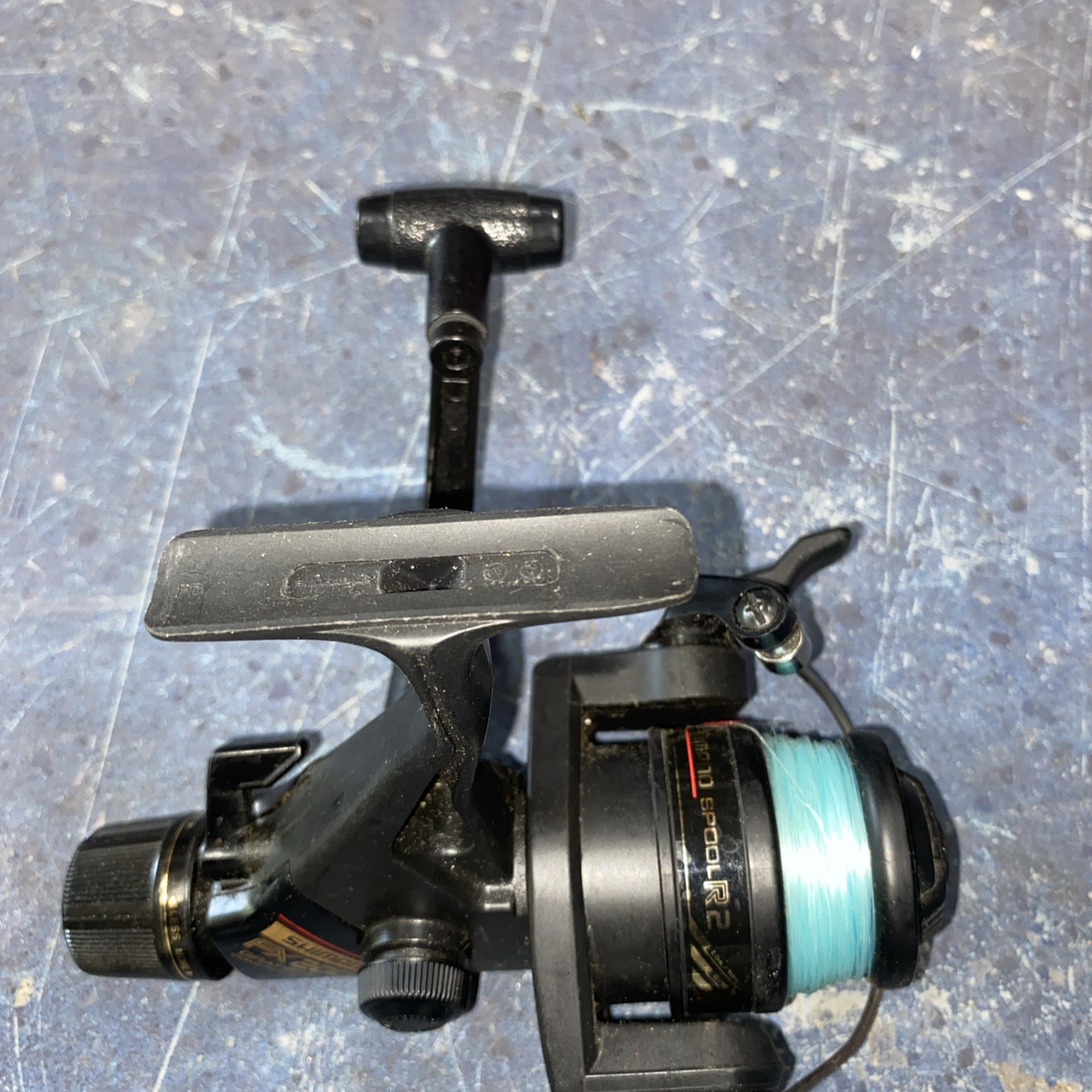 Shimano FX200 Quickfire II Spinning Fishing Reel Graphite, L/R Hand- Excellent