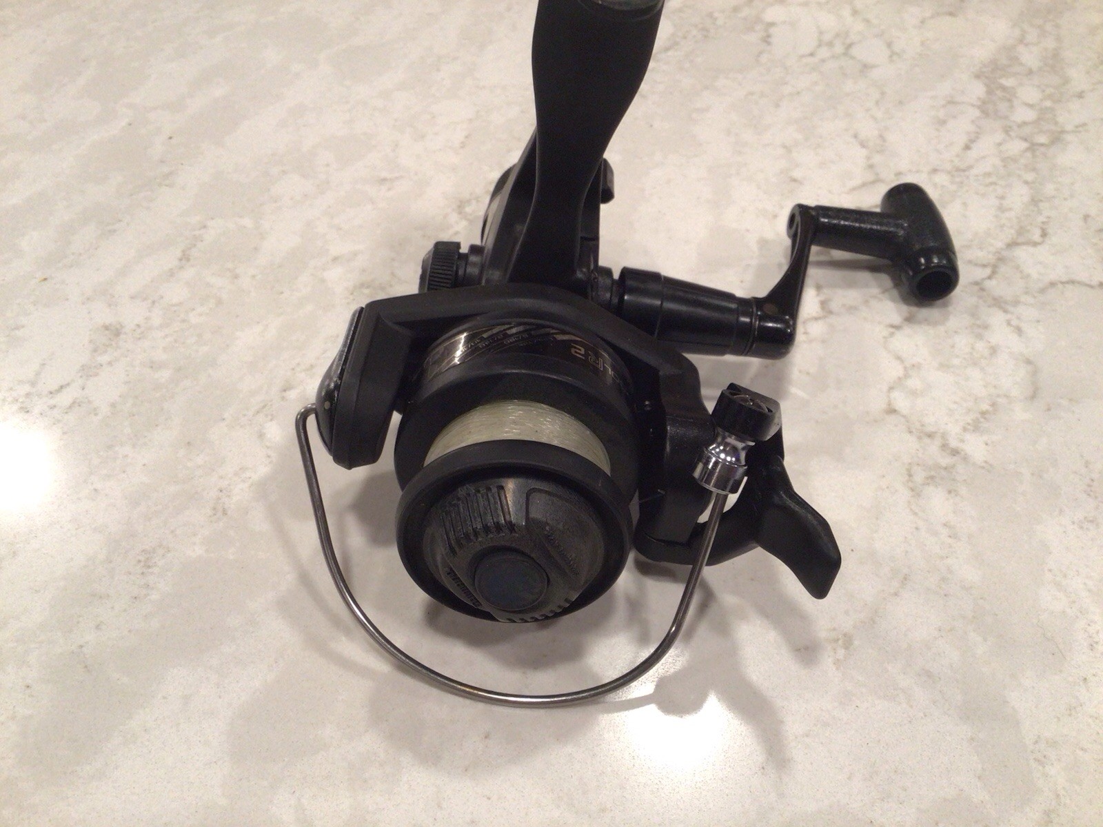 Shimano FX200 Quickfire II Spinning Fishing Reel Graphite, L/R Hand- Excellent